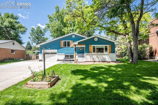 1126 Pike Dr, Colorado Springs, CO 80904 - view of front of house featuring concrete driveway and an attached garage
