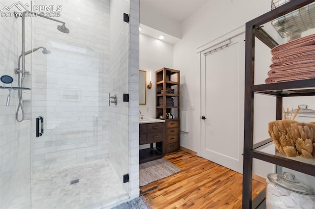 423 W 4th St, Pueblo, CO 81003 - full bath featuring vanity, wood finished floors, and a stall shower