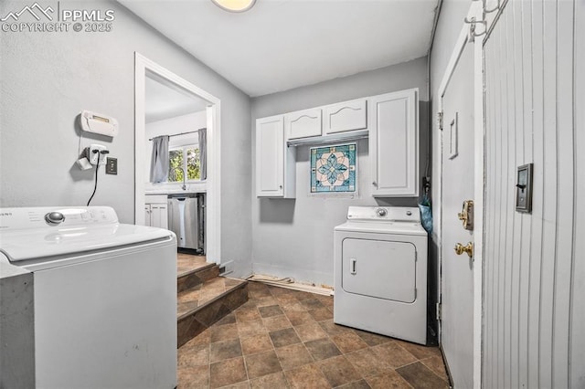 802 Alexander Rd, Colorado Springs, CO 80909 - laundry room with washing machine and clothes dryer, stone finish floors, and cabinet space