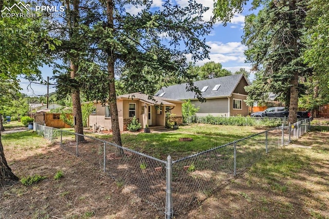 802 Alexander Rd, Colorado Springs, CO 80909 - back of house featuring a fenced backyard and stucco siding