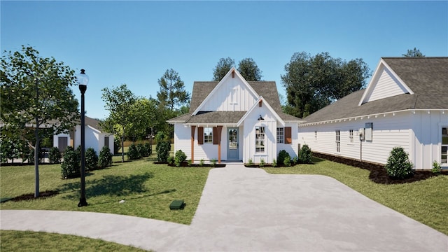 100 Hunters Way, Opelika, AL 36801 - modern inspired farmhouse with board and batten siding, a front yard, an outbuilding, and roof with shingles