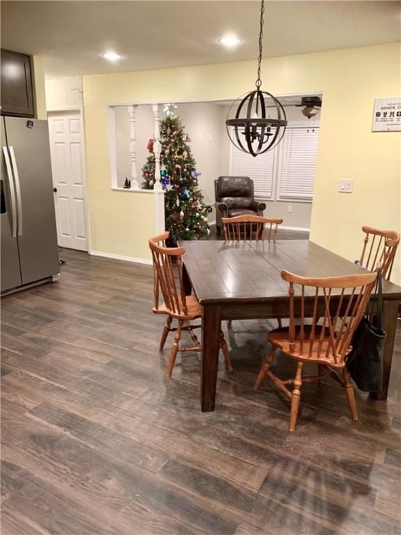 dining area featuring a chandelier and dark hardwood / wood-style floors