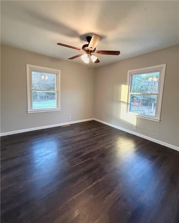 bedroom featuring dark hardwood / wood-style floors and ceiling fan