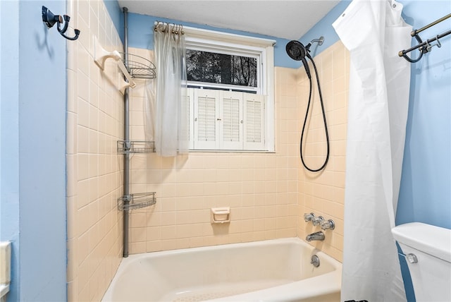 bathroom with toilet and shower / tub combo with curtain