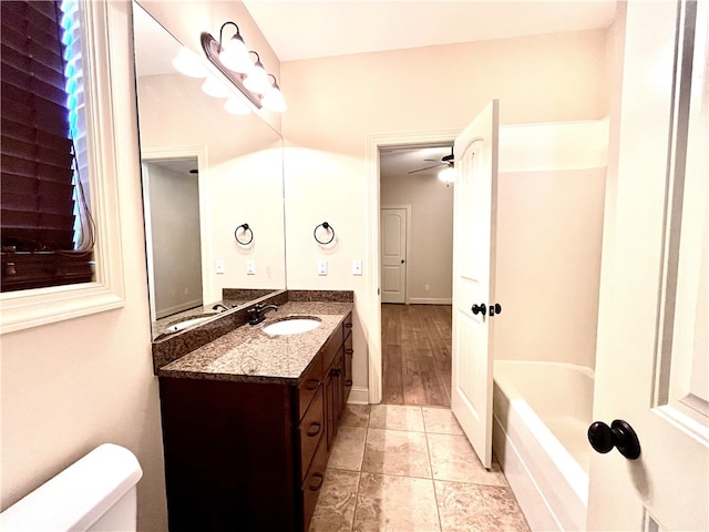 1807 Parsons Cir, Auburn, AL 36830 - bathroom with ceiling fan, toilet, a tub, and vanity