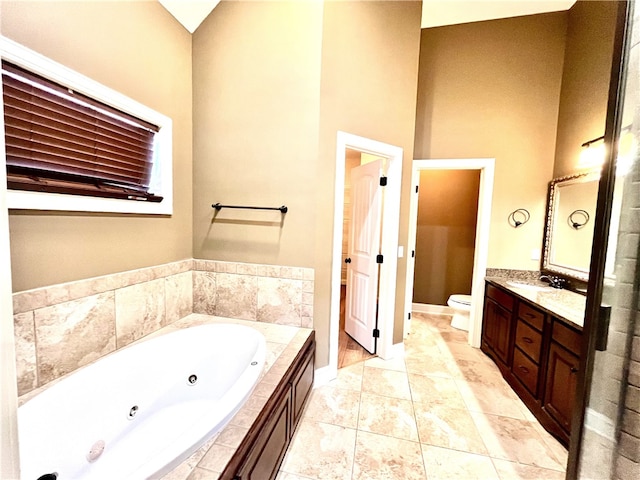 1807 Parsons Cir, Auburn, AL 36830 - bathroom with a relaxing tiled tub, high vaulted ceiling, tile patterned floors, toilet, and vanity
