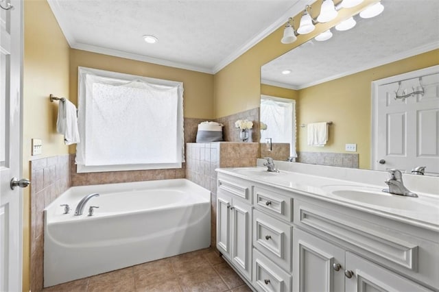 2260 Core Dr, Auburn, AL 36830 - bathroom featuring double vanity, a garden tub, tile patterned floors, and crown molding