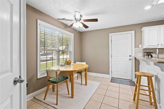 2260 Core Dr, Auburn, AL 36830 - dining room featuring a ceiling fan, light tile patterned floors, and a textured ceiling