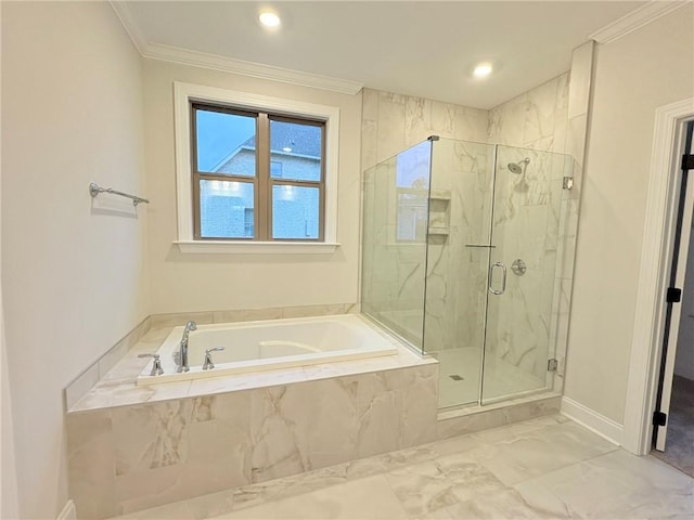 bathroom featuring ornamental molding and independent shower and bath