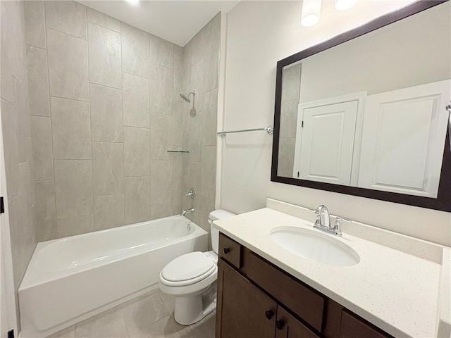 full bathroom with tiled shower / bath combo, vanity, tile patterned floors, and toilet