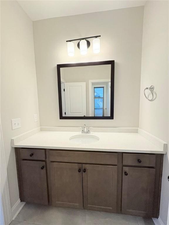 bathroom with tile patterned flooring and vanity