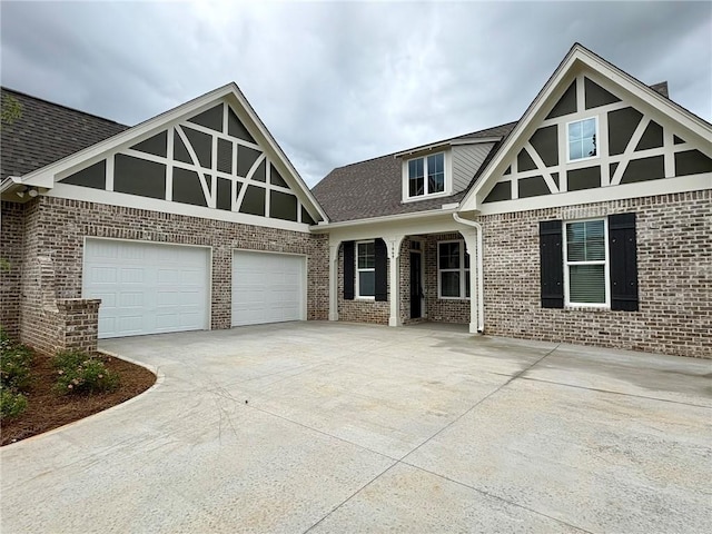 1649 James Burt Pkwy, Auburn, AL 36830 - english style home featuring concrete driveway, brick siding, and a shingled roof