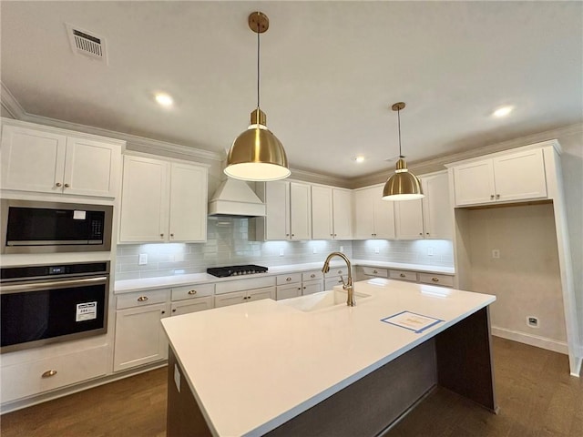 1649 James Burt Pkwy, Auburn, AL 36830 - kitchen with oven, a sink, gas cooktop, built in microwave, and dark wood-type flooring