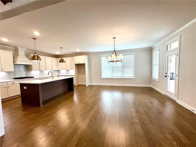 1649 James Burt Pkwy, Auburn, AL 36830 - kitchen featuring premium range hood, crown molding, a chandelier, light countertops, and a sink