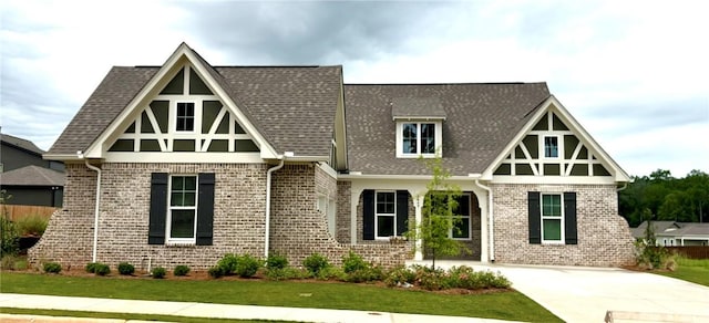1649 James Burt Pkwy, Auburn, AL 36830 - english style home with brick siding, a front lawn, and a shingled roof