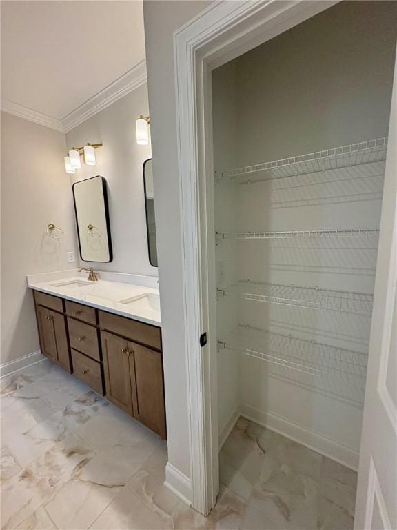 1649 James Burt Pkwy, Auburn, AL 36830 - full bathroom with marble finish flooring, crown molding, double vanity, baseboards, and a walk in closet