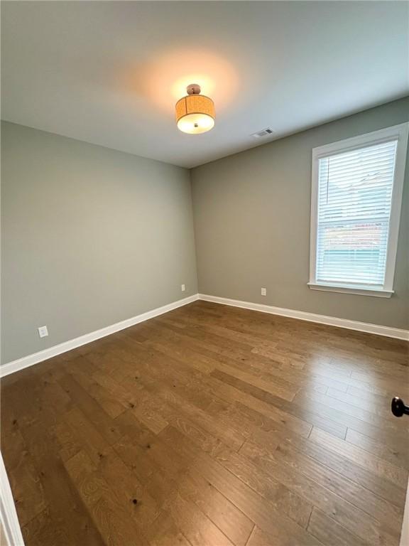 1649 James Burt Pkwy, Auburn, AL 36830 - empty room with dark wood finished floors and baseboards