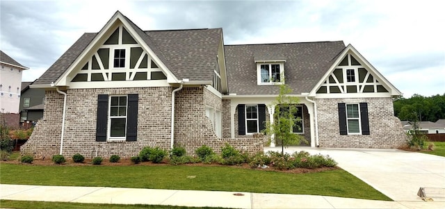 1649 James Burt Pkwy, Auburn, AL 36830 - tudor home featuring brick siding, a front lawn, and roof with shingles