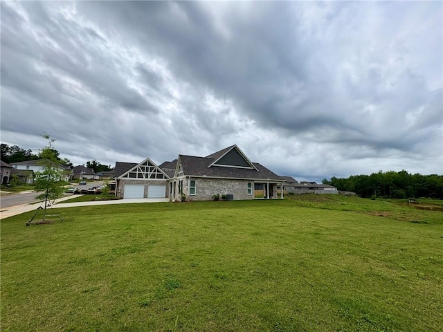 1649 James Burt Pkwy, Auburn, AL 36830 - view of front facade featuring a garage, driveway, a front lawn, and brick siding