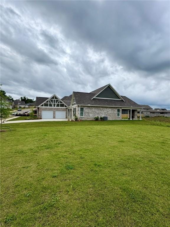 1649 James Burt Pkwy, Auburn, AL 36830 - view of front of house with a front yard, an attached garage, and driveway