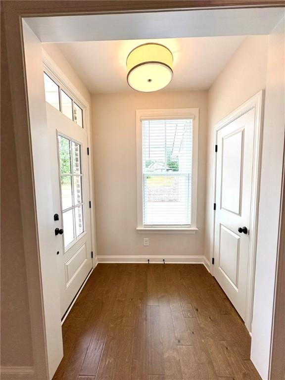 1649 James Burt Pkwy, Auburn, AL 36830 - doorway featuring dark wood-type flooring and baseboards