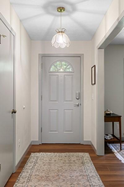 1324 Azalea Dr, Auburn, AL 36830 - foyer with light wood finished floors, baseboards, and a chandelier
