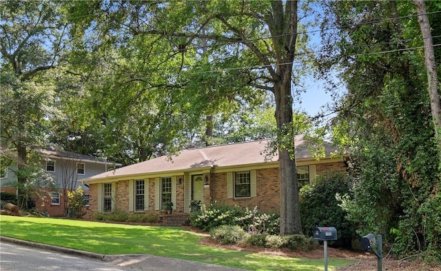 1324 Azalea Dr, Auburn, AL 36830 - view of front of house with brick siding and a front lawn