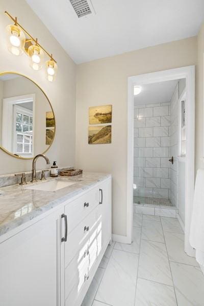 1324 Azalea Dr, Auburn, AL 36830 - full bath with vanity, marble finish floors, a tile shower, and baseboards