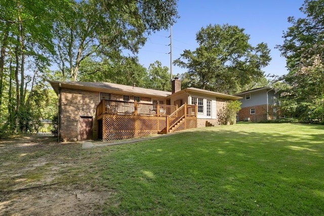 1324 Azalea Dr, Auburn, AL 36830 - rear view of house with a lawn, brick siding, a wooden deck, a chimney, and stairway