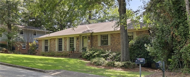 1324 Azalea Dr, Auburn, AL 36830 - view of front facade with brick siding and a front lawn