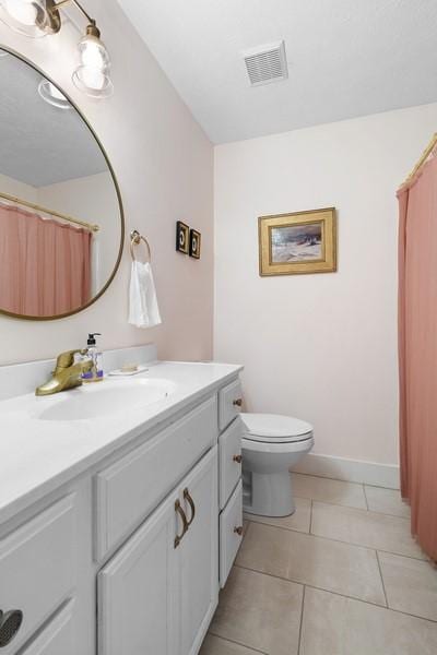 1324 Azalea Dr, Auburn, AL 36830 - full bathroom featuring vanity, toilet, tile patterned flooring, and a shower with curtain