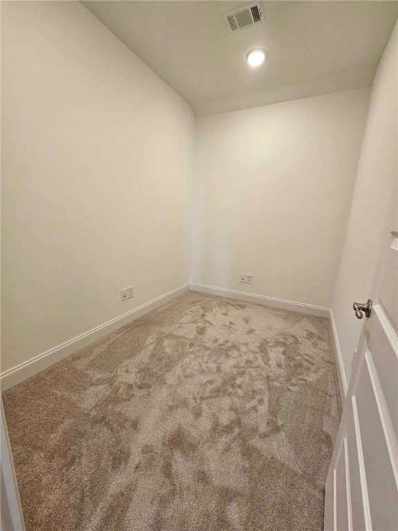 unfurnished room featuring carpet