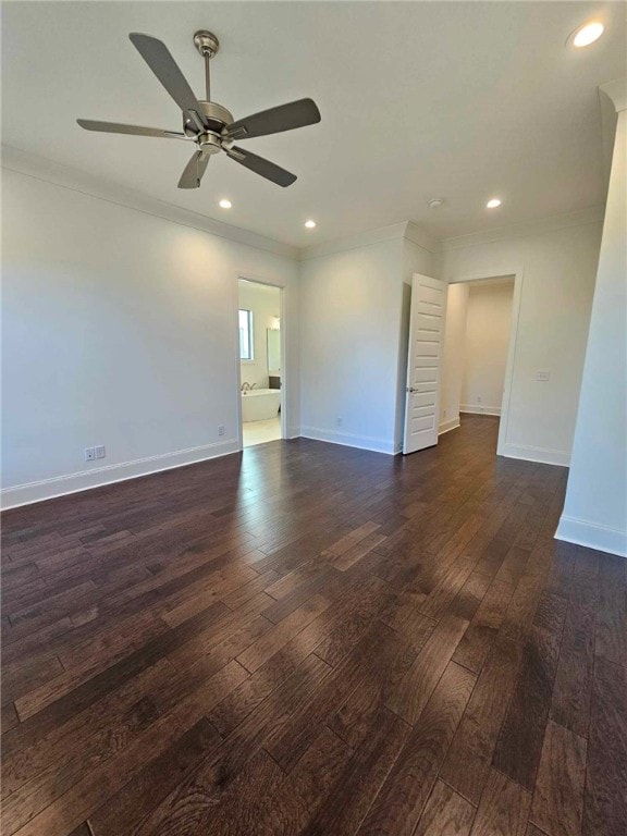 empty room with dark hardwood / wood-style floors, ceiling fan, and ornamental molding