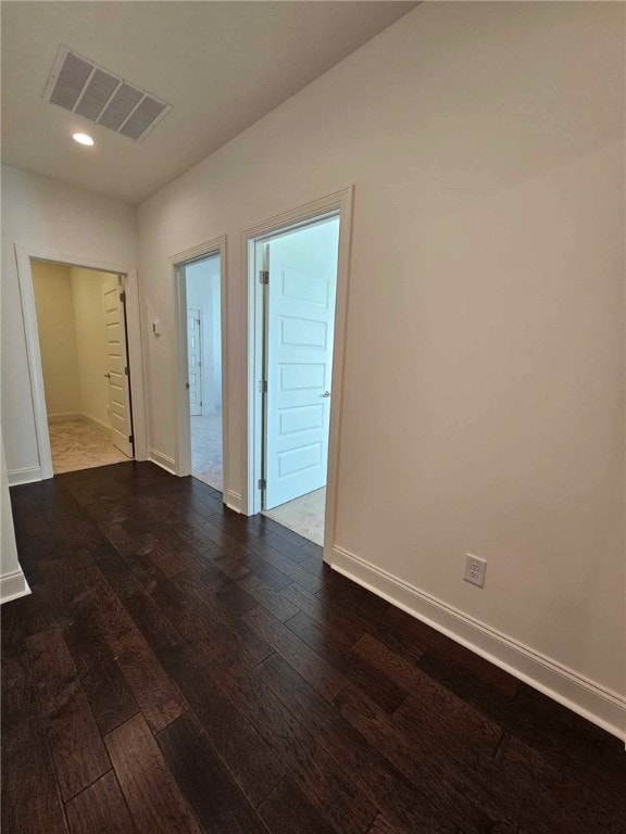 spare room with dark hardwood / wood-style flooring