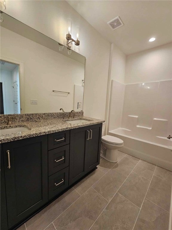 full bathroom with tile patterned floors, vanity, bathing tub / shower combination, and toilet