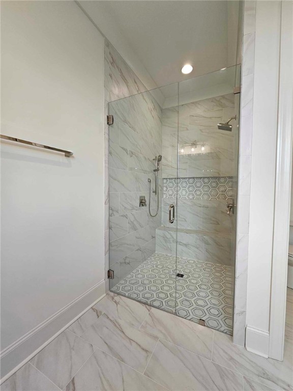 bathroom featuring an enclosed shower