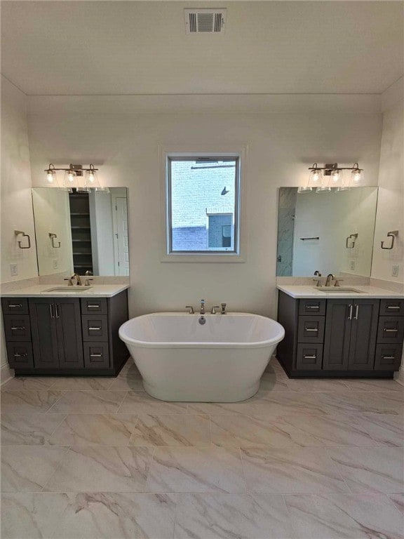 bathroom featuring a bathing tub and vanity