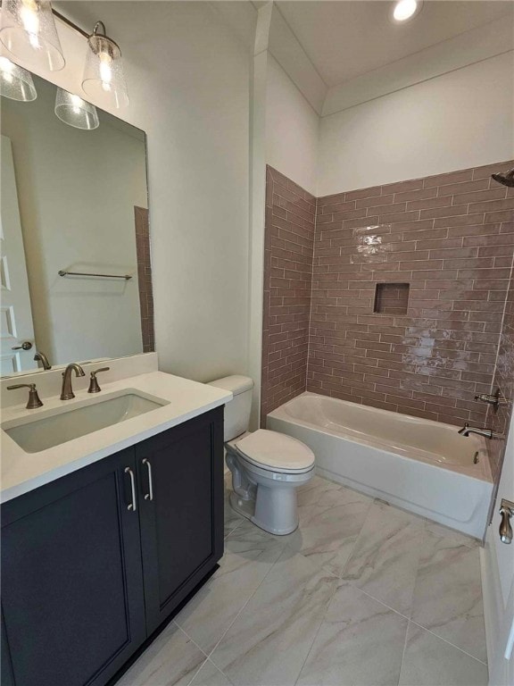 full bathroom with vanity, tiled shower / bath combo, and toilet