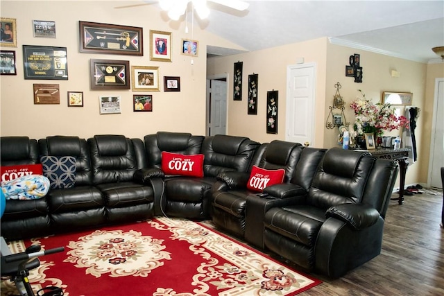 cinema featuring a ceiling fan, ornamental molding, vaulted ceiling, and wood finished floors