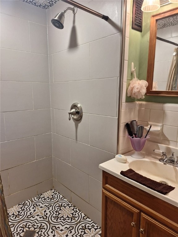 1701 53rd St, Valley, AL 36854 - bathroom with a shower stall, vanity, tile patterned floors, and tile walls