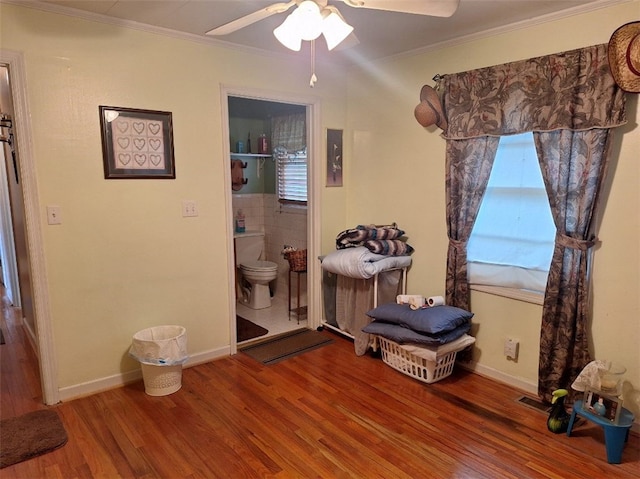 1701 53rd St, Valley, AL 36854 - bedroom featuring wood finished floors, ornamental molding, ensuite bath, and a ceiling fan