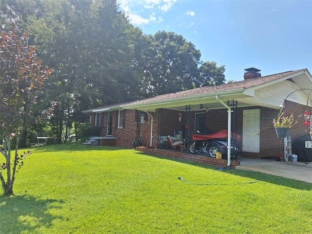 1701 53rd St, Valley, AL 36854 - view of front of home featuring a front lawn, brick siding, and a chimney