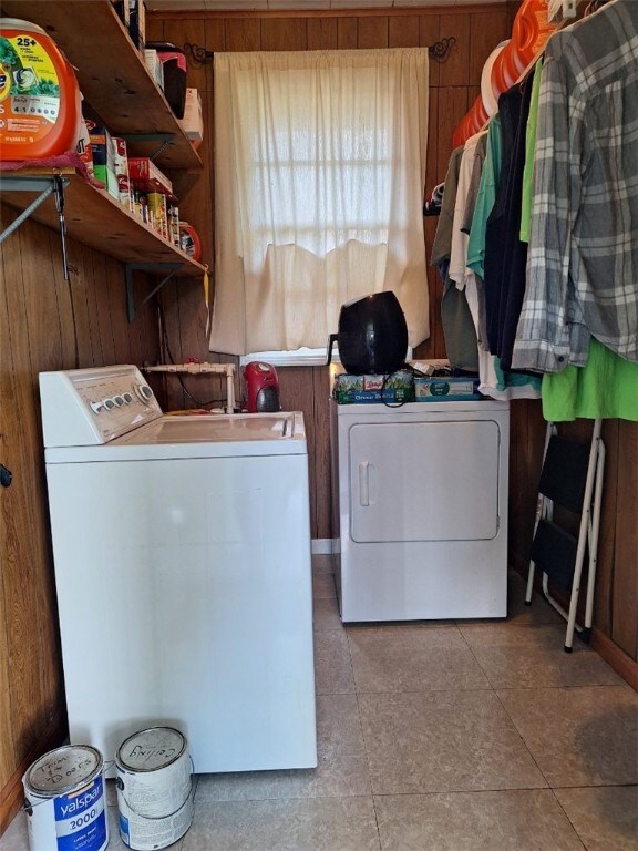 1701 53rd St, Valley, AL 36854 - washroom featuring washing machine and dryer and wood walls
