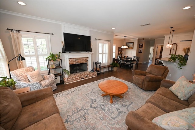 living room with a fireplace, dark wood-type flooring, and ornamental molding