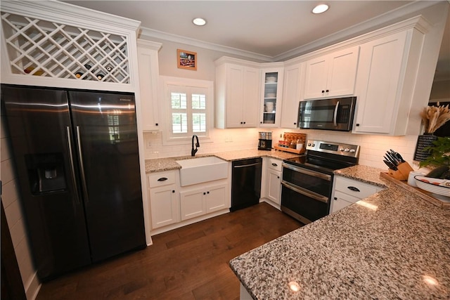 kitchen featuring white cabinetry, light stone countertops, and appliances with stainless steel finishes