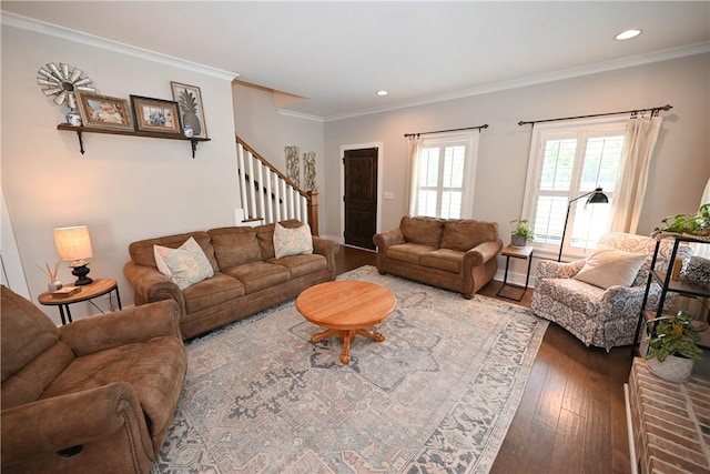 living room with crown molding and hardwood / wood-style floors