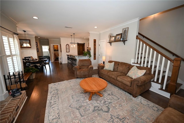 living room with crown molding and dark hardwood / wood-style floors