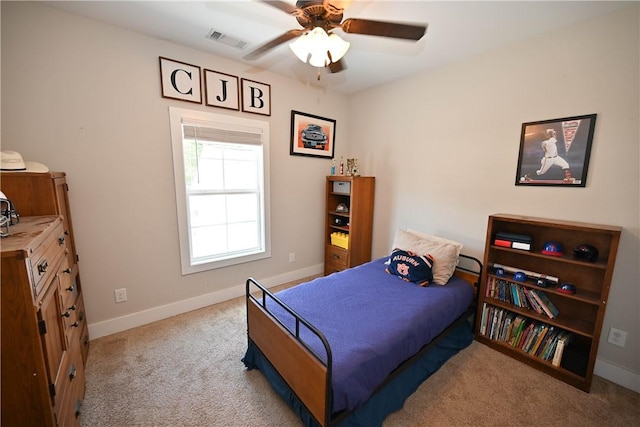 bedroom with light colored carpet and ceiling fan