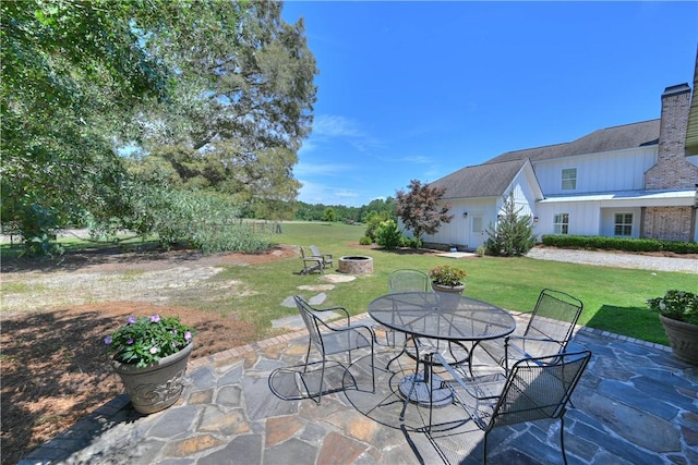 view of patio with an outdoor fire pit