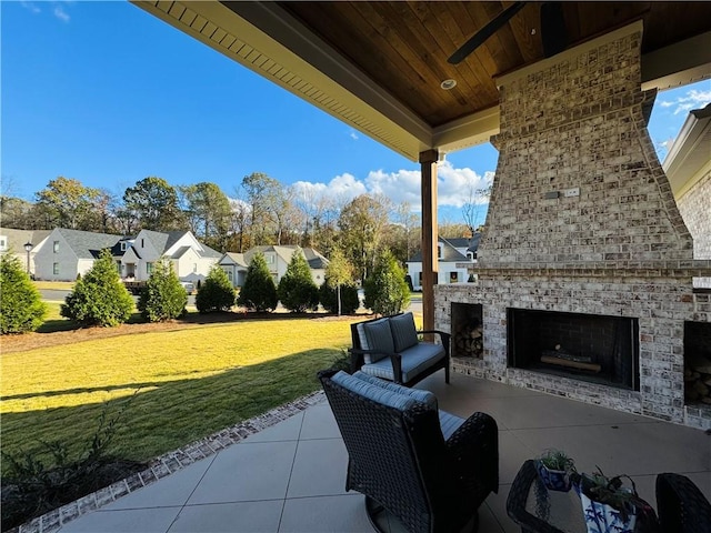 view of patio featuring an outdoor living space with a fireplace